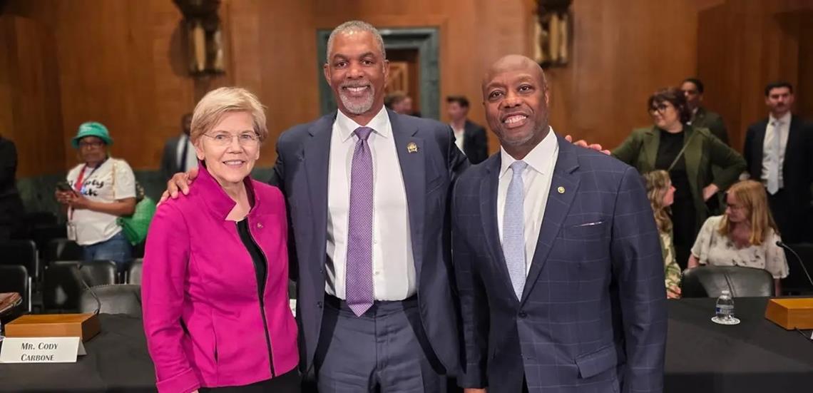 NAR President Kevin Brown poses with Senate Banking, Housing, and Urban Affairs Committee Chairman Tim Scott (R-S.C.) and Ranking Member Sen. Elizabeth Warren (D-Mass.) following his testimony before the Senate Banking Committee on June 23. Brown appeared before the committee to advocate for policies to improve housing affordability and increase supply, including the bipartisan 21st Century ROAD to Housing Act.